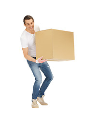 Image showing handsome man with big box