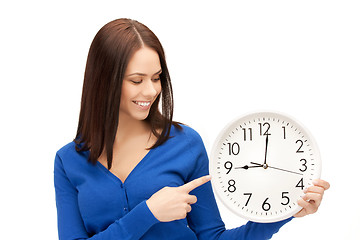 Image showing woman holding big clock