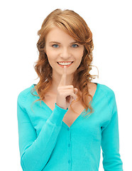 Image showing teenage girl with finger on lips