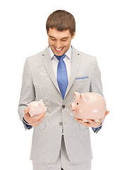 Image showing man with piggy bank