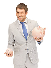 Image showing man with piggy bank