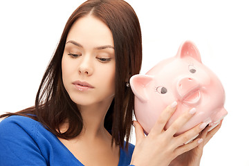 Image showing lovely woman with piggy bank