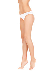 Image showing female legs in white bikini panties