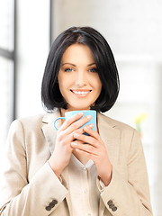 Image showing lovely businesswoman with mug