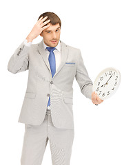 Image showing man with clock