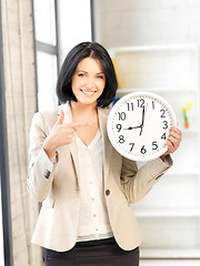 Image showing businesswoman with clock