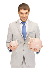 Image showing man with piggy bank