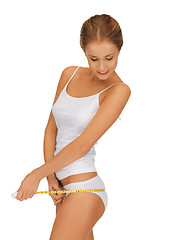 Image showing woman measuring her hips