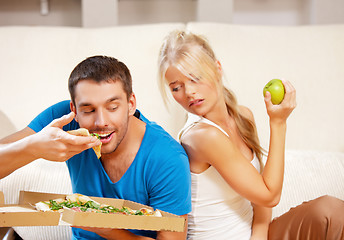 Image showing couple eating different food