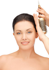 Image showing beautiful woman with comb