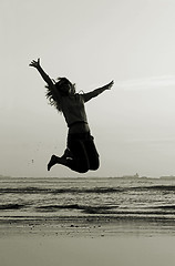 Image showing Jumping on the beach