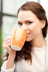 Image showing lovely businesswoman with mug