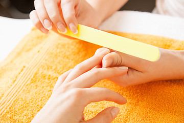 Image showing manicure process on female hands