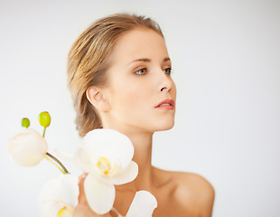 Image showing lovely woman with orchid flower