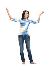 Image showing woman in casual clothes showing direction