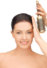 Image showing beautiful woman with comb