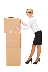 Image showing businesswoman with big boxes