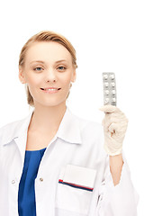 Image showing attractive female doctor with pills