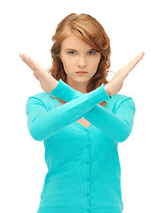 Image showing young woman making stop gesture