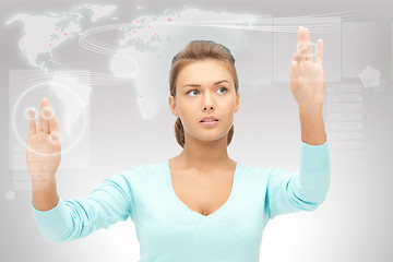 Image showing businesswoman working with touch screen