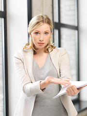 Image showing worried woman with documents