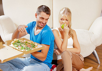 Image showing couple eating different food