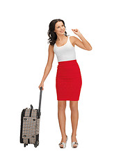 Image showing hitch-hiking woman with suitcase