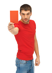 Image showing handsome man with red card