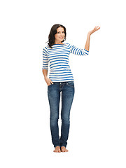 Image showing woman in casual clothes showing direction