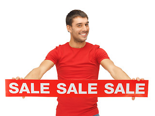 Image showing handsome man with sale sign