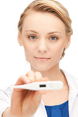 Image showing attractive female doctor with thermometer