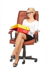 Image showing businesswoman with folders sitting in chair