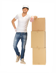 Image showing handsome builder with big boxes