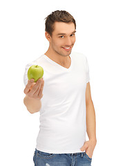 Image showing man in white shirt with green apple