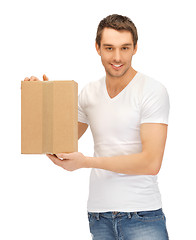 Image showing handsome man with big box