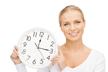 Image showing woman holding big clock