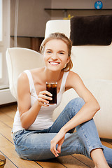 Image showing smiling teenage girl with chips and coke