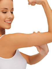 Image showing sporty woman flexing her biceps