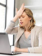 Image showing stressed woman with laptop computer