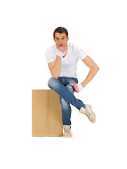 Image showing handsome man with big box