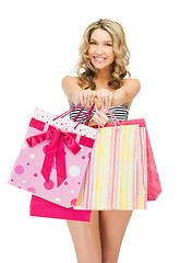 Image showing seductive woman in bikini with shopping bags
