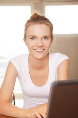 Image showing happy teenage girl with laptop computer