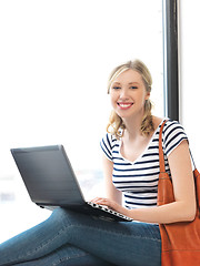 Image showing happy teenage girl with laptop computer