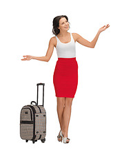 Image showing happy woman with suitcase greeting