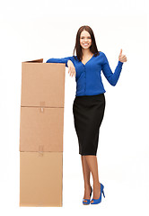 Image showing businesswoman with big boxes