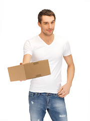 Image showing handsome man with box