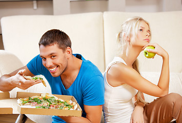 Image showing couple eating different food