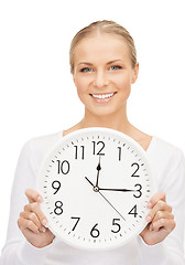 Image showing woman holding big clock