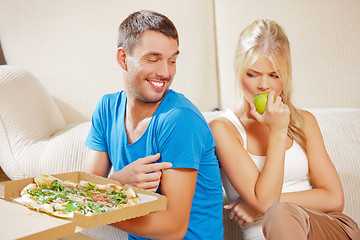 Image showing couple eating different food