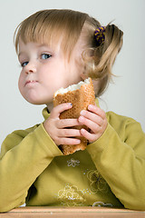 Image showing child eating bread